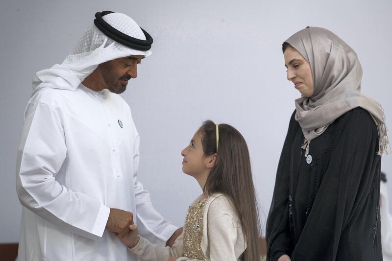 ABU DHABI, UNITED ARAB EMIRATES -  March 12, 2018: HH Sheikh Mohamed bin Zayed Al Nahyan, Crown Prince of Abu Dhabi and Deputy Supreme Commander of the UAE Armed Forces (L), presents an Abu Dhabi Award to Layan Al Zoebie (C) and Dr Lama Al Zoebie (R), who are receiving the award on behalf of their late father, Dr Azzam Al Zoebie (not shown) during the awards ceremony at the Sea Palace.
( Ryan Carter for the Crown Prince Court - Abu Dhabi )
---