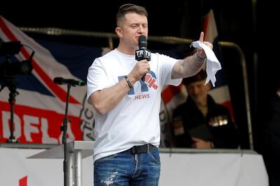 Far-right activist Stephen Yaxley-Lennon, who goes by the name Tommy Robinson, speaks outside the Houses of Parliament at a pro-Brexit demonstration in London, Britain March 29, 2019. REUTERS/Alkis Konstantinidis