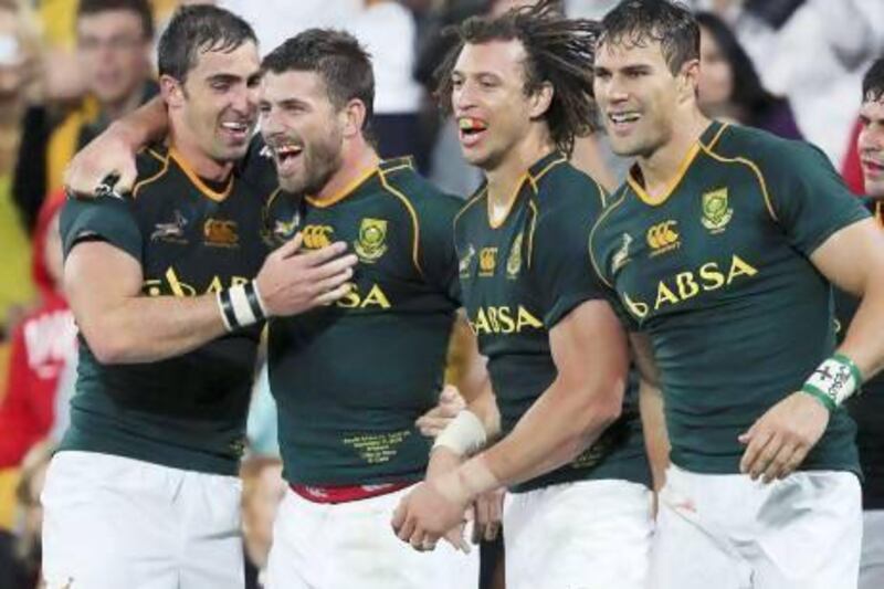 South African players, from left, Ruan Pienaar, Willie le Roux, Zane Kirchner and JJ Engelbrecht, celebrate their victory over Australia.