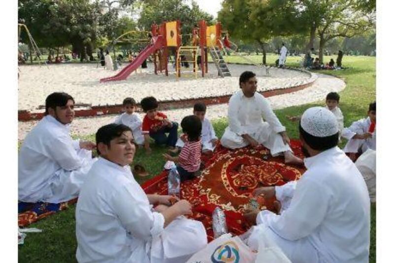People enjoy a picnic in Safa park in Dubai. A reader suggests installing lights and seating facilities for students who like to read and study in public parks. Pawan Singh / The National