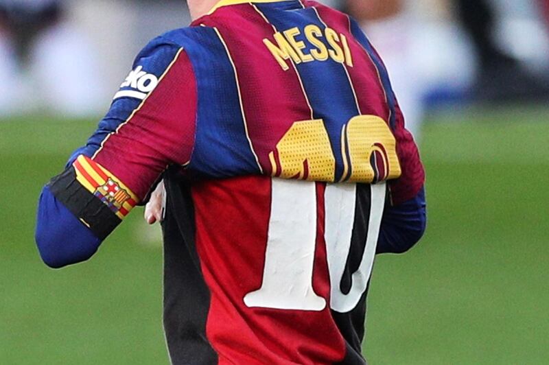 Barcelona's Lionel Messi celebrates scoring their fourth goal against Osasuna by revealing a Newell's Old Boys shirt in tribute to the late Argentina player Diego Maradona on Tuesday, November 29. Reuters