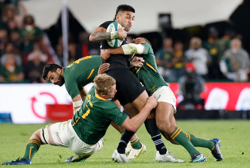 New Zealand's Rieko Ioane is tackled by South Africa's Pieter-Steph du Toit, Damian de Allende and Damian Willemse. AFP