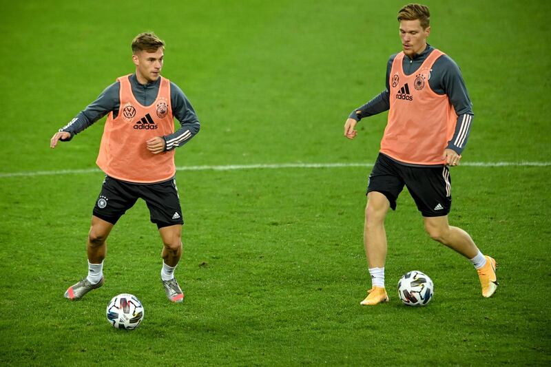 Joshua Kimmich (L) and Marcel Halstenberg (R) attend a training session in Cologne. EPA