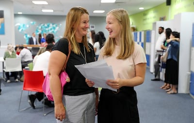 ABU DHABI ,  UNITED ARAB EMIRATES , AUGUST 22 – 2019 :- Cara Easton ( right )  with her mother after receiving the GCSE results at the Brighton College in Abu Dhabi. ( Pawan Singh / The National ) For News. Story by Kelly