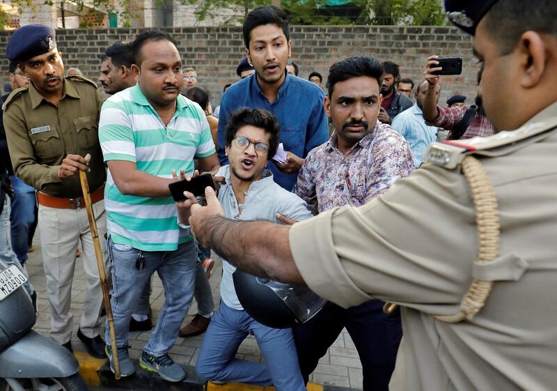 Police detain a demonstrator during a protest to show solidarity with the students of New Delhi's Jamia Millia Islamia university after police entered the university campus on Sunday following a protest against a new citizenship law, in Ahmedabad, India, December 16, 2019. REUTERS/Amit Dave