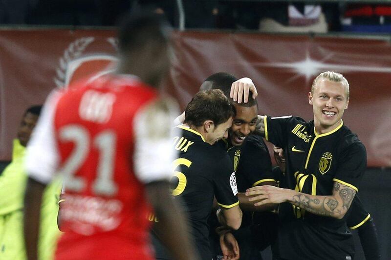 Lille celebrate with Ronny Rodelin, second from right, after his goal on Saturday. Pascal Rossignol / Reuters