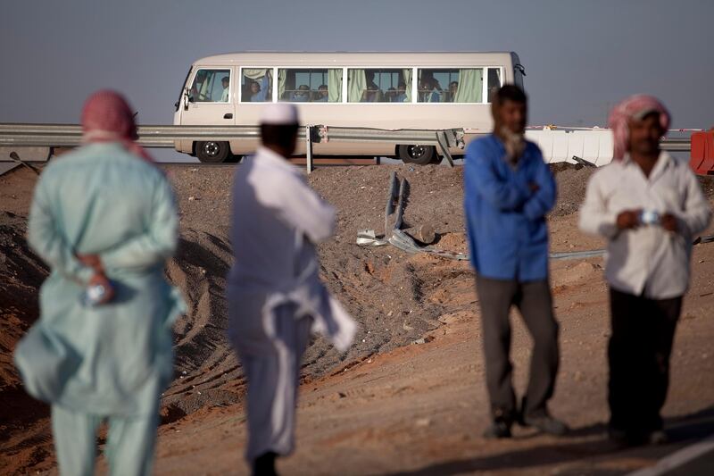 Al Ain, United Arab Emirates, February 4, 2013: 
TRaffic flows by a scene of a tragic traffic accident, which involved a truck and a bus full of laborers and has left 22 people dead and sent many to a hospital, on Monday early evening, Feb. 4, 2013, at the scene of the accident, about 35km from Al Ain on the Abu Dhabi - Al Ain road. The accident happened at 7:30am as the bus, loaded with 45 workers, 95 percent of which were reported Bangladeshi, carried the people to their work at a nearby palace. The bus travelers were employees of the Al Hakeem Decorations and have worked at the palace as maintenance crew.
Silvia Razgova / The National
