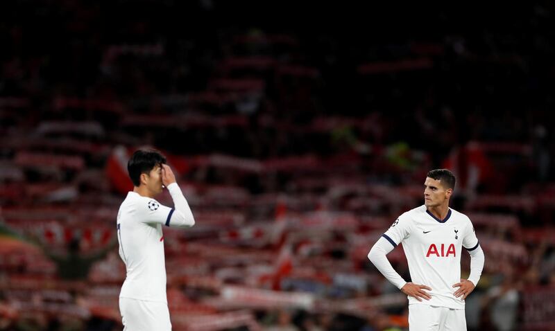 Tottenham Hotspur's Son Heung-min and Erik Lamela look dejected after the match. Reuters