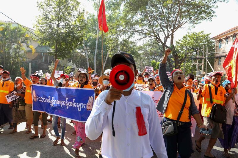 Staff from the Yangon City Development Committee march during a demonstration against the military coup in Yangon. AFP