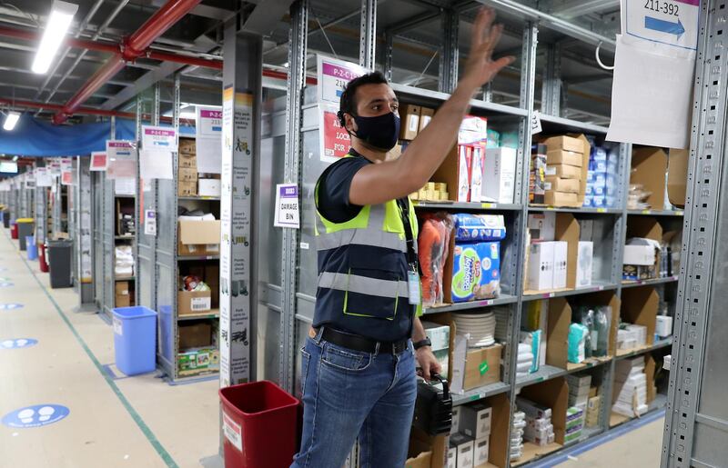 DUBAI, UNITED ARAB EMIRATES , March 18, 2021 –  Geoffrey Khalil, inbound operations manager explaining about the working operations at the Amazon DXB3,  Amazon fulfilment centre  in Dubai Logistics City in Dubai. (Pawan Singh / The National) For Lifestyle/Online/Instagram. Story by Farah