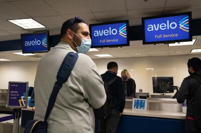 Passenger wearing protective masks check-in ahead of the Avelo Airlines inaugural flight at Hollywood Burbank Airport (BUR) in Burbank, California, U.S., on Wednesday, April 28, 2021. New money is flowing to low-cost airlines in the U.S. as they take on giant carriers racing to recover from the unprecedented collapse in travel during the pandemic. Photographer: Bing Guan/Bloomberg