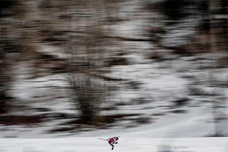 A biathlete competes in the individual men's biathlon 2020 Lausanne Winter Youth Olympic Games event at Premanon.  AFP