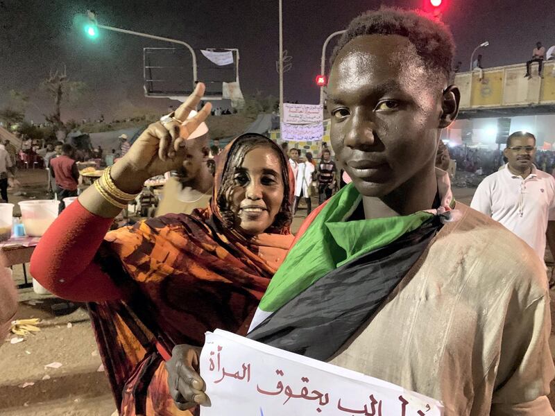 This May 1, 2019 photo shows Sudanese protester Mohammed Bakr campaigning for women's rights at the site of a sit-in outside the headquarters of the Sudanese armed forces. Photo by Hamza Hendawi for The National. 