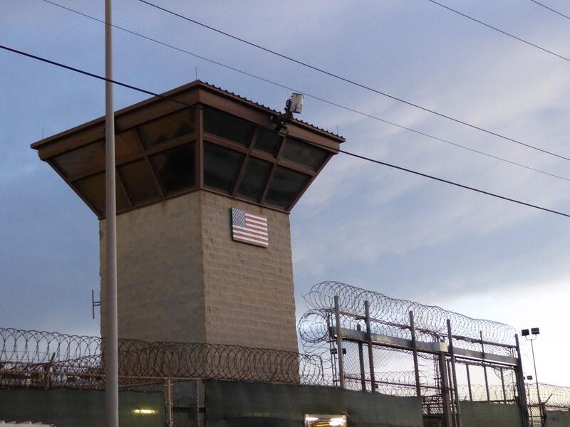FILES) In this file photo taken on October 16, 2018, the main gate at the prison in Guantanamo at the US Guantanamo Naval Base in Guantanamo Base, Cuba. Three of the 40 prisoners still at the Guantanamo Bay US military prison have been approved for release, a lawyer for one said on May 18, 2021, the first such approvals under the administration of President Joe Biden. The three included Pakistani Saifullah Paracha, who at 73 is the oldest of those still held, nearly two decades after the United States detained hundreds of suspects in the wake of the September 11, 2001 attacks.
 / AFP / Sylvie LANTEAUME
