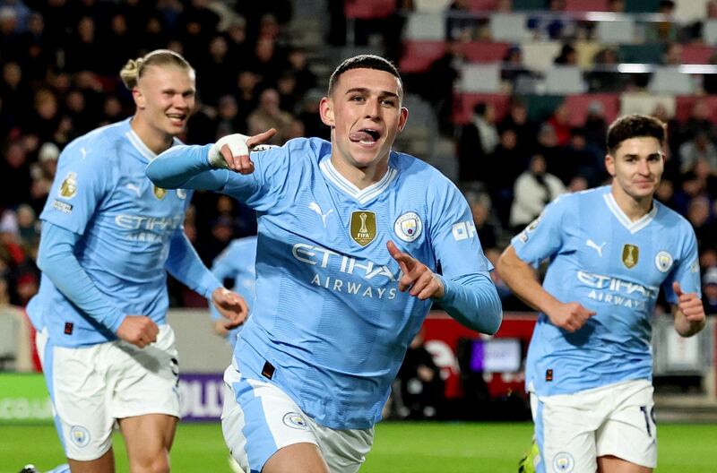Soccer Football - Premier League - Brentford v Manchester City - Brentford Community Stadium, London, Britain - February 5, 2024 Manchester City's Phil Foden celebrates scoring their second goal with Erling Braut Haaland and Julian Alvarez REUTERS/David Klein NO USE WITH UNAUTHORIZED AUDIO, VIDEO, DATA, FIXTURE LISTS, CLUB/LEAGUE LOGOS OR 'LIVE' SERVICES.  ONLINE IN-MATCH USE LIMITED TO 45 IMAGES, NO VIDEO EMULATION.  NO USE IN BETTING, GAMES OR SINGLE CLUB/LEAGUE/PLAYER PUBLICATIONS.      TPX IMAGES OF THE DAY