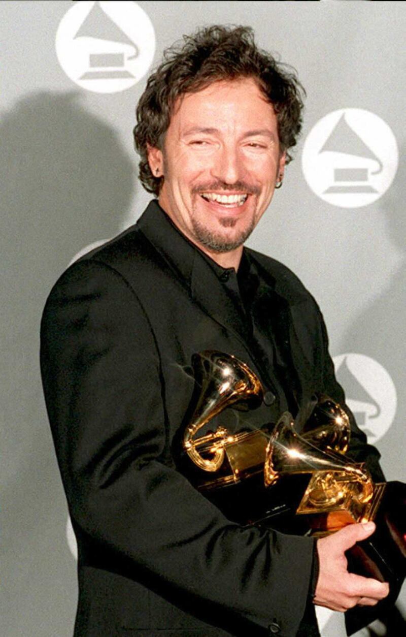 Springsteen with his four Grammy Awards for Song of the Year, Best Male Rock Vocal Performance, Best Rock Song and Best Song Written specifically for a Motion Picture or TV for his song 'Streets of Philadelphia' on March 1, 1995. AFP