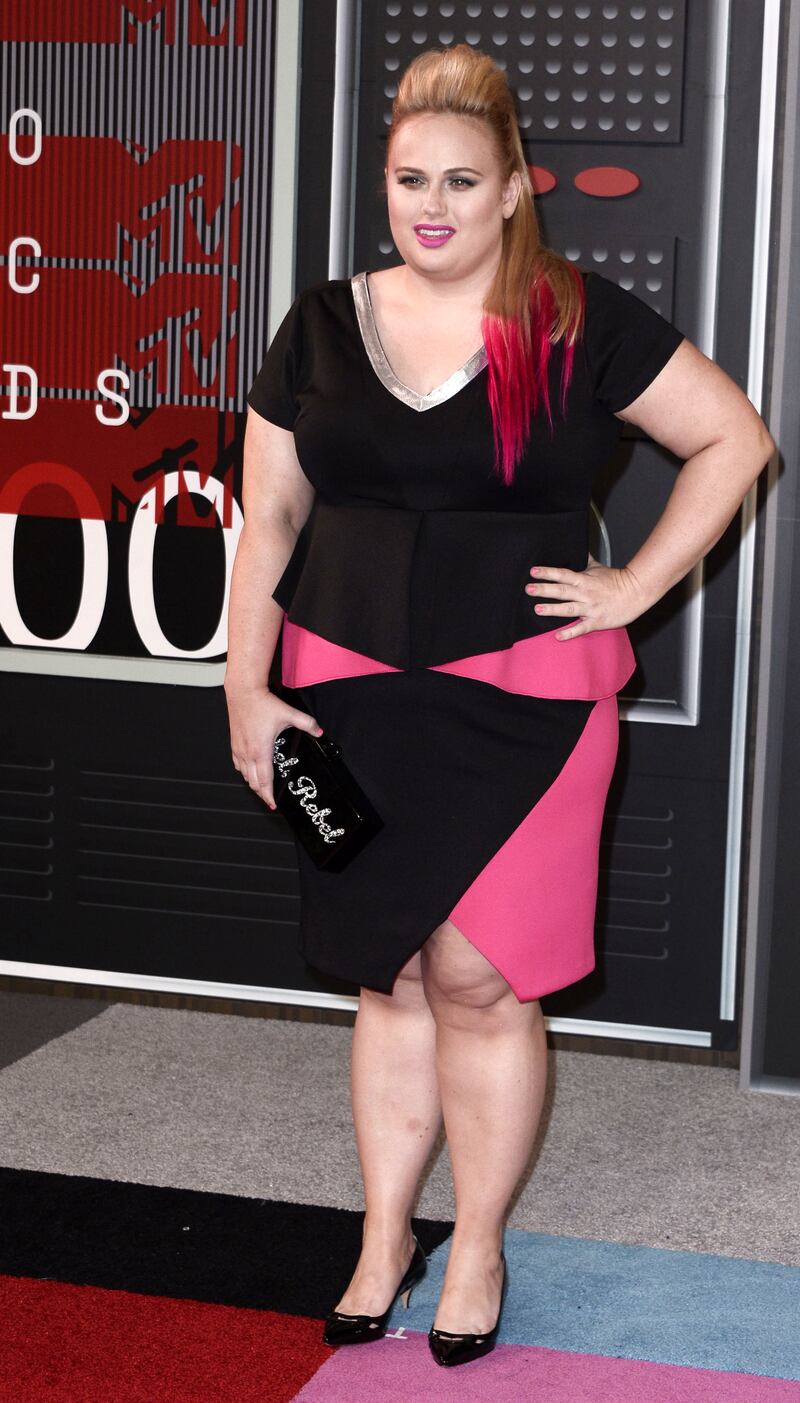 Rebel Wilson, wearing a black and pink peplum dress, attends the 32nd MTV Video Music Awards in Los Angeles on August 30, 2015. EPA
