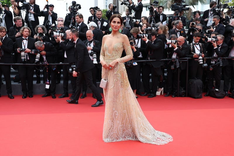 Farnoush Hamidian in an embroidered gold gown. Getty