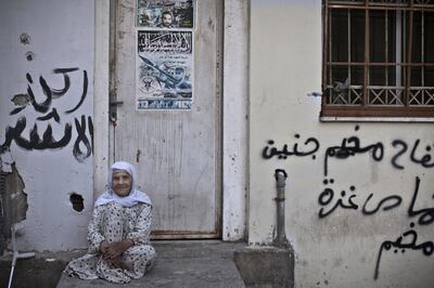 Palestinian refugee Ameenah Al-Saadi, 90, at the entrance of her home in the West Bank refugee camp of Jenin. She was 24 years old when she and her husband were forced to leave their village near the northern Israeli town of Beit Shean.