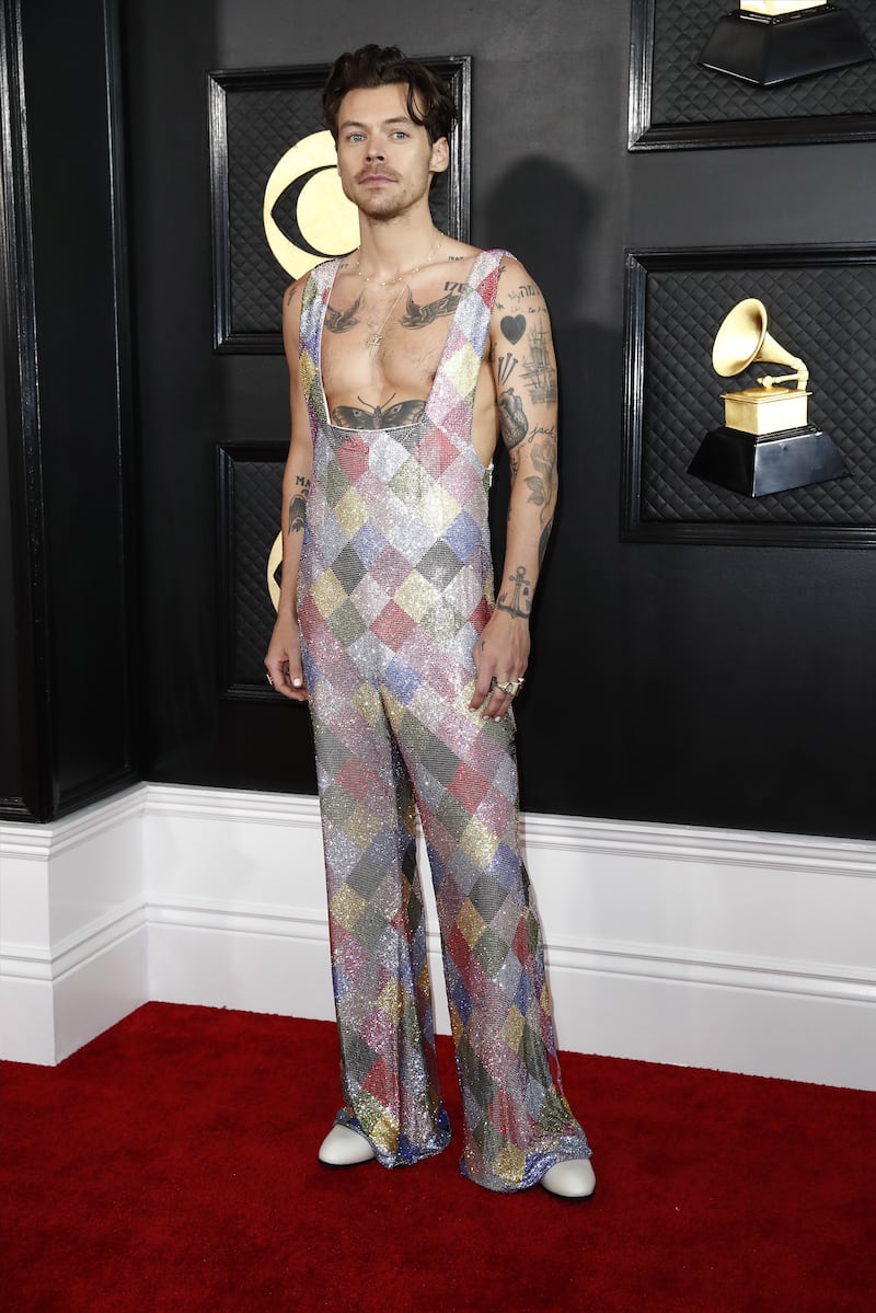 Harry Styles wears a custom diamond-patterned jumpsuit by Egonlab and Swarovski. EPA