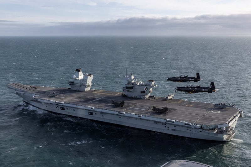 HMS Queen Elizabeth is on a month-long training mission but without a full stock of fighter jets and munitions. Reuters