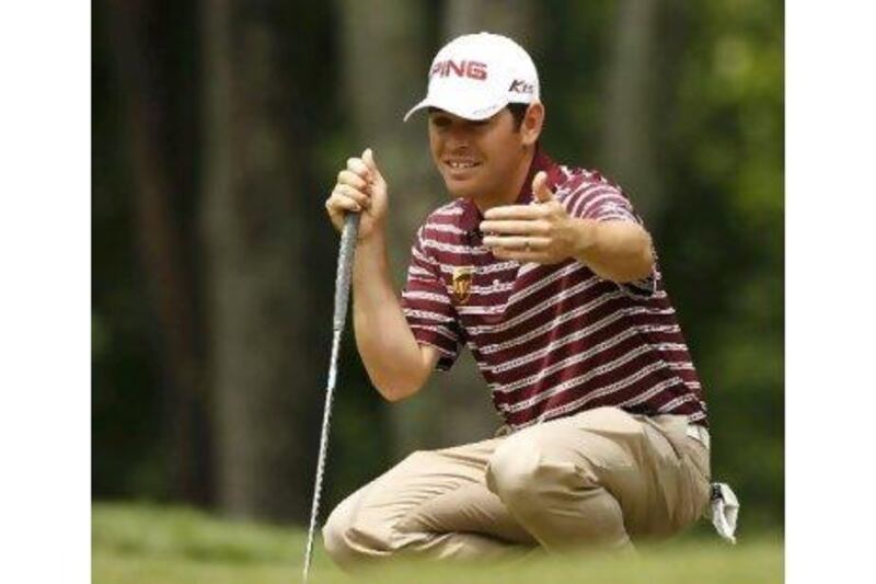 South Africa's Louis Oosthuizen looks at his putt on the 12th green during the first round of the 2011 US Open yesterday. Jeff Haynes / Reuters