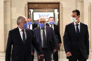 Syrian President Bashar Al Assad wears a face mask while receiving a Russian delegation in Damascus.  EPA