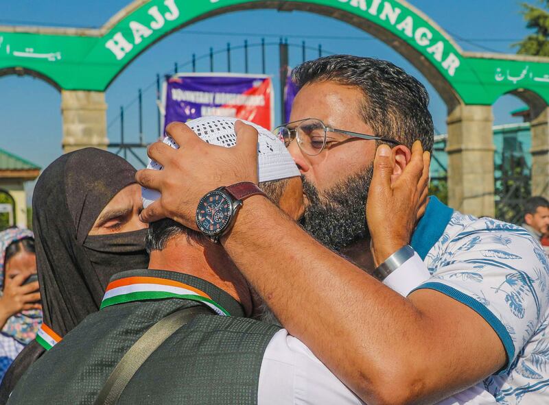 In Srinagar, a relative kisses a pilgrim before departure for the Hajj pilgrimage to the holy city of Makkah. EPA