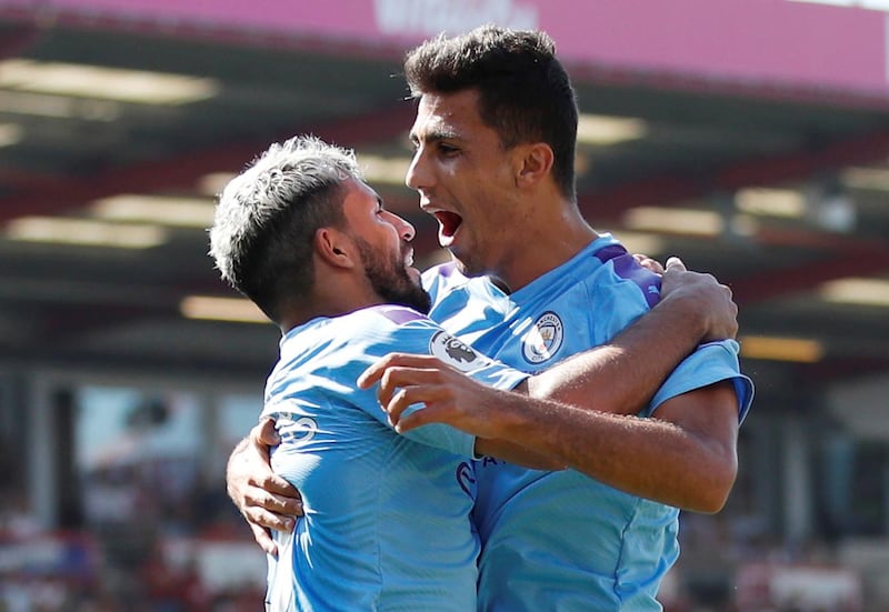 Manchester City's Sergio Aguero celebrates with Rodri. Reuters