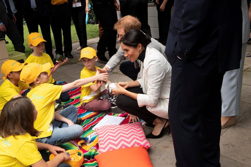 Prince Harry and Meghan, the Duchess of Sussex chat with schoolchildren at the Invictus Games' lunch Reuters