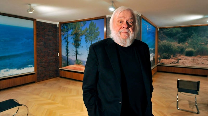 epa08107455 (FILE) - US conceptional artist John Baldessari stands in his installation 'brick building, huge windows with excellent view, partly furnished, well-known architect' in Krefeld, Germany, 27 February 2009 (reissued 06 January 2020). Baldessari died on 02 January 2020 at the age of 88, his foundation confirmed on 05 January 2020.  EPA/BERND THISSEN  GERMANY OUT