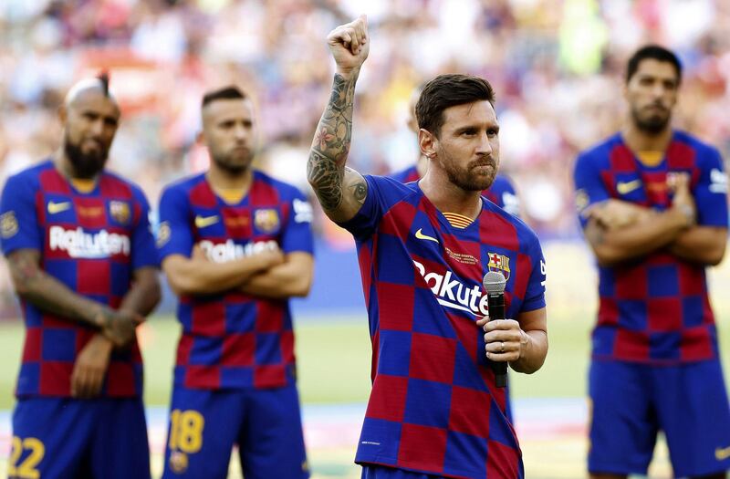 Lionel Messi talks to the crowd before Sunday's game. He has apparently suffered an injury scare on Monday. EPA