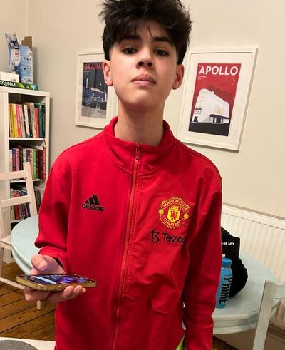 Dubai student Cameron Dean wearing Manchester United player Christian Eriksen's jacket Photo: Cameron Dean