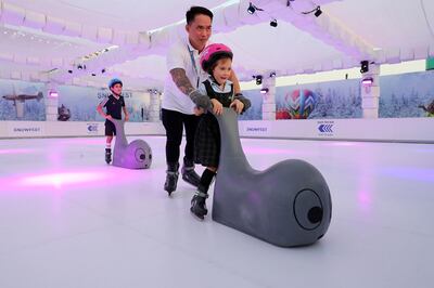 Children enjoying the Snowfest Ice Rink at the global village in Dubai. Pawan Singh / The National