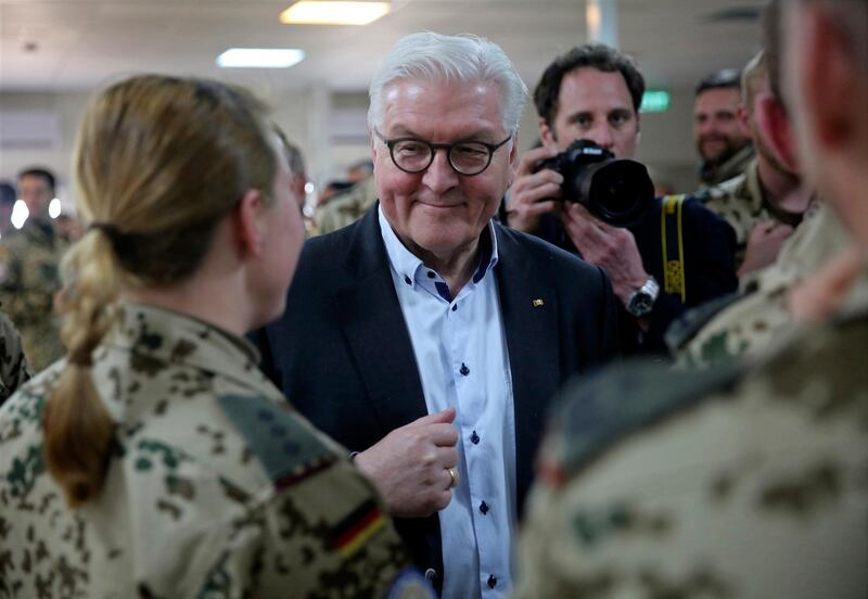 German President Frank-Walter Steinmeier meets German troops stationed in a remote airbase in northern Jordan on Monday, Jan. 29, 2018. Steinmeier said moving German troops from Turkey to Jordan as part of an international military campaign against Islamic State extremists was "the right choice. Germany carries out reconnaissance and refueling missions over Syria and Iraq, where IS once held large areas. (AP Photo/Sam McNeil)