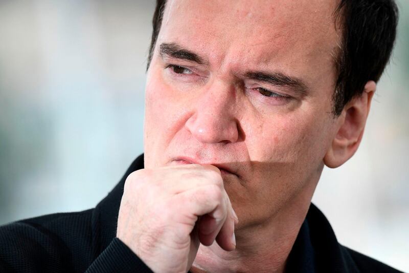 TOPSHOT - US film director Quentin Tarantino poses during a photocall for the film "Once Upon a Time... in Hollywood" at the 72nd edition of the Cannes Film Festival in Cannes, southern France, on May 22, 2019.  / AFP / CHRISTOPHE SIMON

