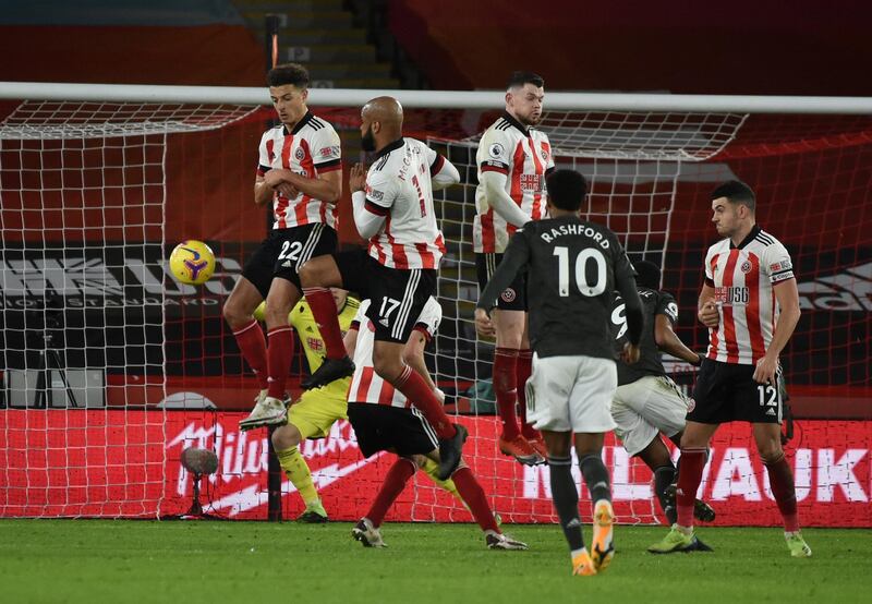 Manchester United's Marcus Rashford, takes a free kick during the English Premier League soccer match between Sheffield United and Manchester United at the Bramall Lane stadium in Sheffield, England, Thursday, Dec. 17, 2020. Manchester United won the match 3-2. (AP Photo/Rui Vieira, Pool)
