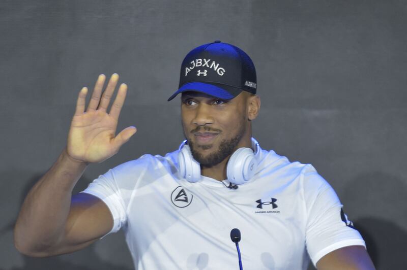Britain's Anthony Joshua greets the fans. AFP