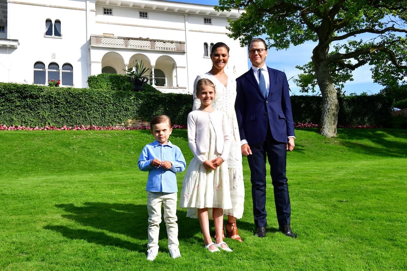 Crown Princess Victoria (3rd L) Prince Daniel (R) and their two children Oscar and Estelle pose in the garden of the family summer palace Solliden on Oland island in the Baltic on July 14, 2020. - The Crown Princess celebrates her birthday with just her close family because of the ongoing coronavirus pandemic. (Photo by Jonas EKSTROMER / TT News Agency / AFP) / Sweden OUT