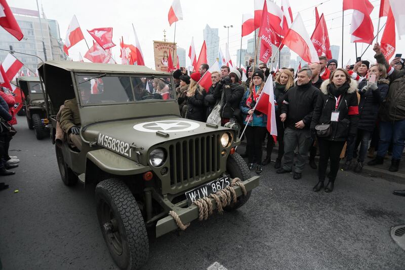 People watch veterans driving past during celebrations on the National Independence Day in Warsaw, Poland November 11, 2019. Slawomir Kaminski/Agencja Gazeta via REUTERS  ATTENTION EDITORS - THIS IMAGE WAS PROVIDED BY A THIRD PARTY. POLAND OUT. NO COMMERCIAL OR EDITORIAL SALES IN POLAND.