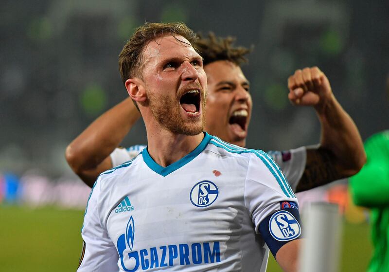 FILE - In this March 17, 2017 file photo Schalke's captain Benedikt Hoewedes  celebrates after the Europa League soccer match between Borussia Moenchengladbach and FC Schalke 04 at the Borussia Park in Moenchengladbach, Germany. German national defender Benedikt Hoewedes has started his medical on Wednesday Aug. 30, 2017  in Turin, Italy, ahead of a proposed move from FC Schalke 04 to Juventus. (AP Photo/Martin Meissner,file)