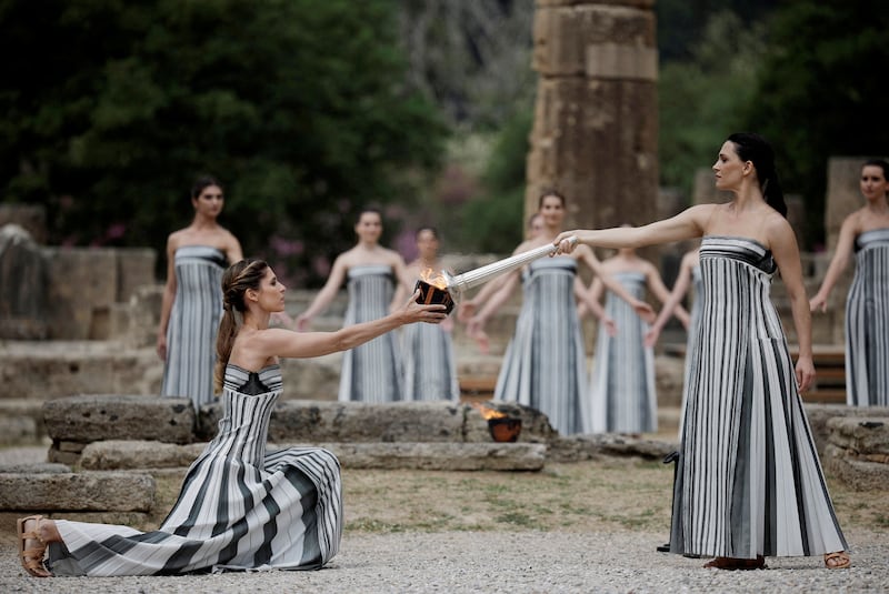 Greek actress Mary Mina, playing the role of High Priestess, lights the flame during the Olympic Flame lighting ceremony in Greece for the Paris 2024 Olympics. Reuters