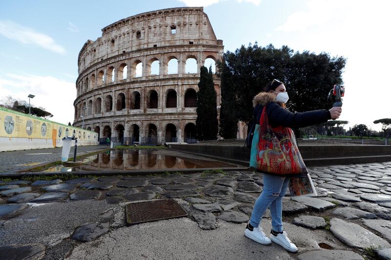 A tourist guide gives a virtual tour at the Colosseum in Rome, Italy. Reuters