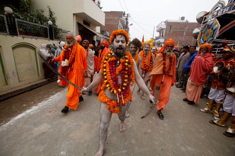 Naga Sadhus, or naked Hindu holy men of the Anand Akhada group, participate in a religious procession towards the Sangam, the confluence of rivers Ganges, Yamuna and mythical Saraswati, as part of the Mahakumbh festival in Allahabad, India, Sunday, Jan. 6, 2013. Millions of Hindu pilgrims are expected to take part in the large religious congregation on the banks of Sangam during the Mahakumbh festival in January 2013, which falls every 12th year. (AP Photo/Rajesh Kumar Singh) *** Local Caption ***  India Kumbh Festival.JPEG-04a47.jpg