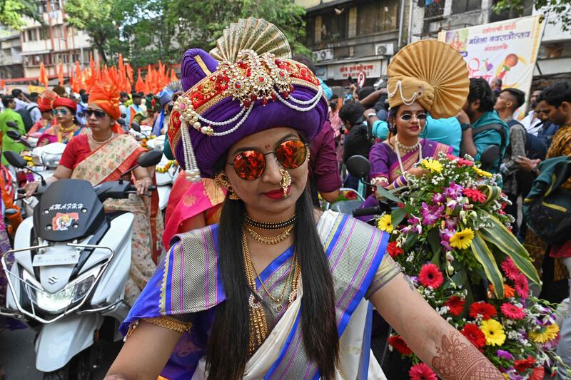 Women dressed in traditional attire and finery take part in a procession celebrating Gudi Padwa or the Maharashtrian New Year, in Mumbai. AFP