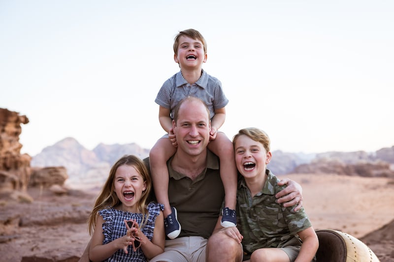 The Duke of Cambridge with his children, Prince George, right, Prince Louis and Princess Charlotte, in Jordan in 2021. PA