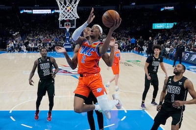 Oklahoma City Thunder's Shai Gilgeous-Alexander, whose plays you can collect via NBA NFTs, scores against the Brooklyn Nets. Photo: AP 