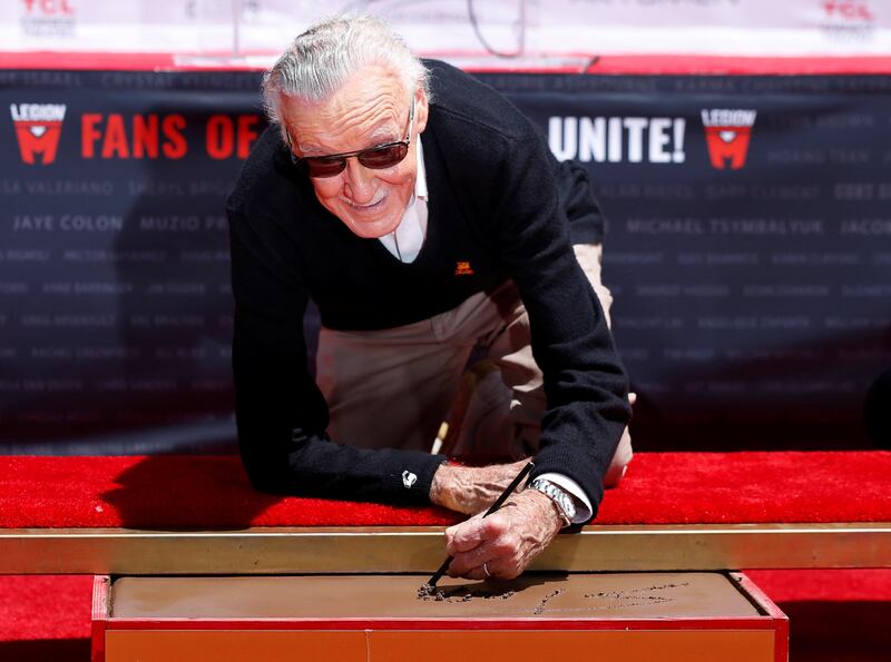 Marvel Comics co-creator Stan Lee places his signature in cement during a ceremony in the forecourt of the TCL Chinese theatre. Mario Anzuoni / Reuters