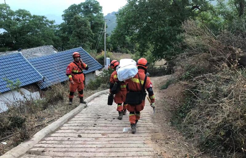 Chinese rescue workers set up tents for the homeless hours after a 6.4-magnitude earthquake in Yangbi county, Yunnan province. EPA