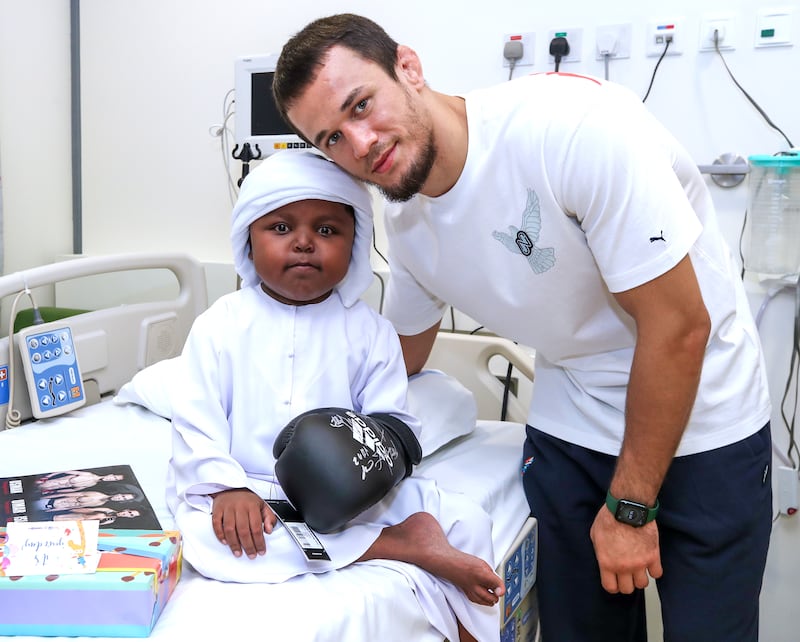 Usman Nurmagomedov with Mohamed Abdul Aziz at the Al Jalila Children's Hospital in Dubai.